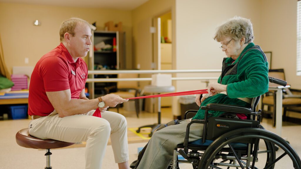 A woman goes through physical therapy at a short term rehab facility