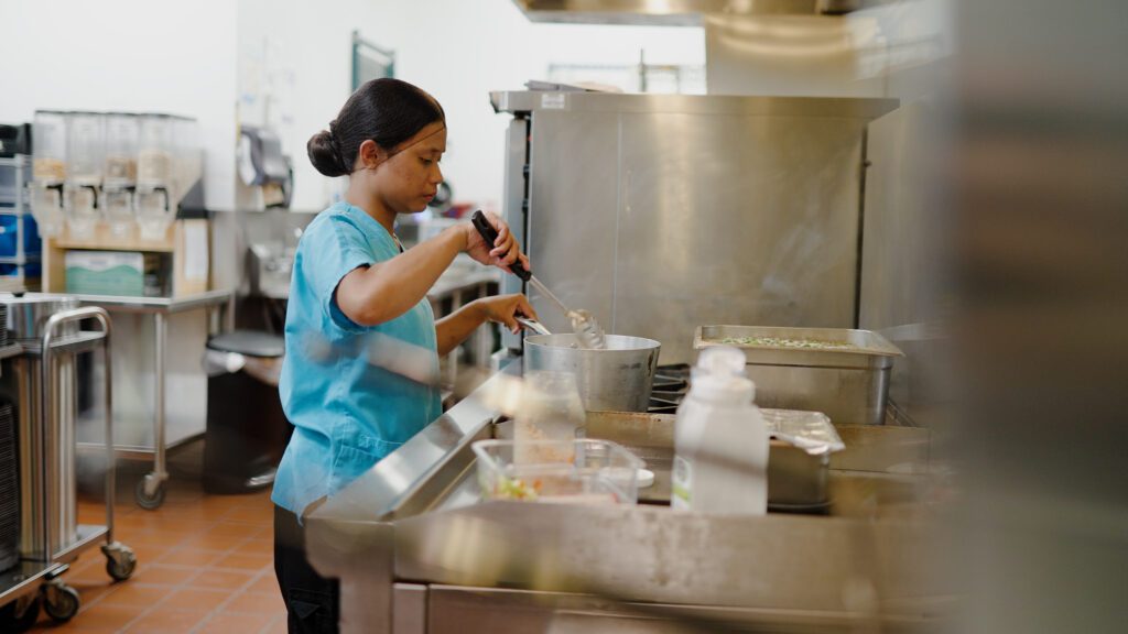 A kitchen staff worker at a long term care facility